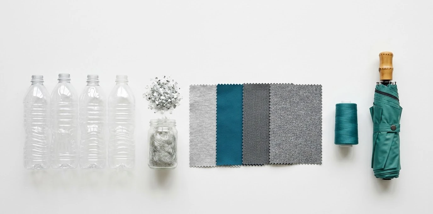 Recycled plastic PET bottles transformed into RPET fabric for umbrella canopy production