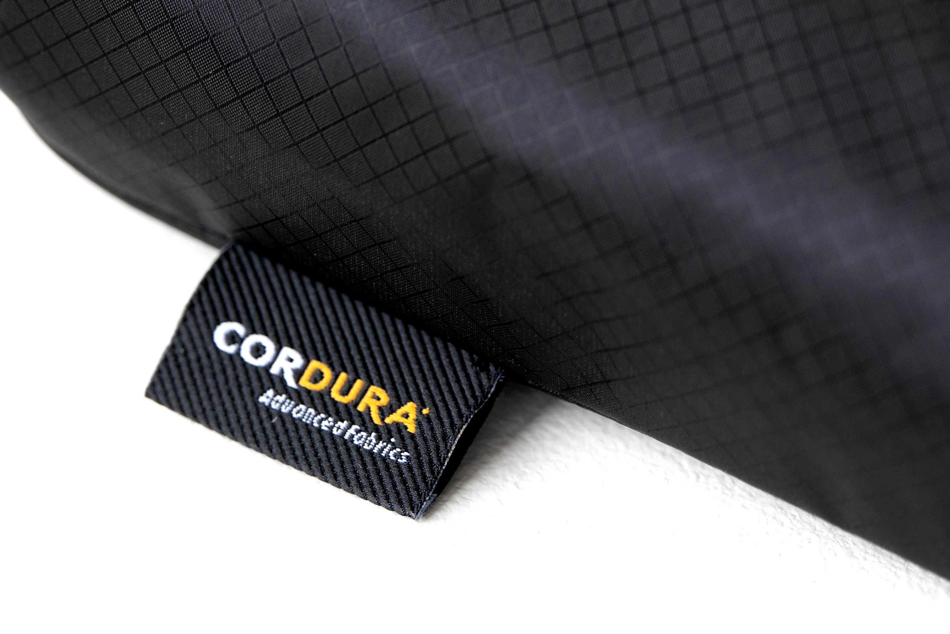 Compact storage case with carabiner